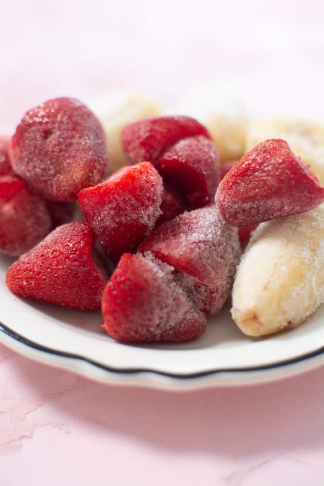 close up of frozen strawberries and bananas