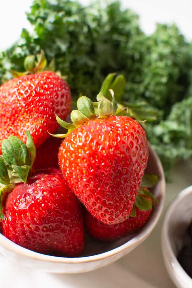 fresh strawberries and kale