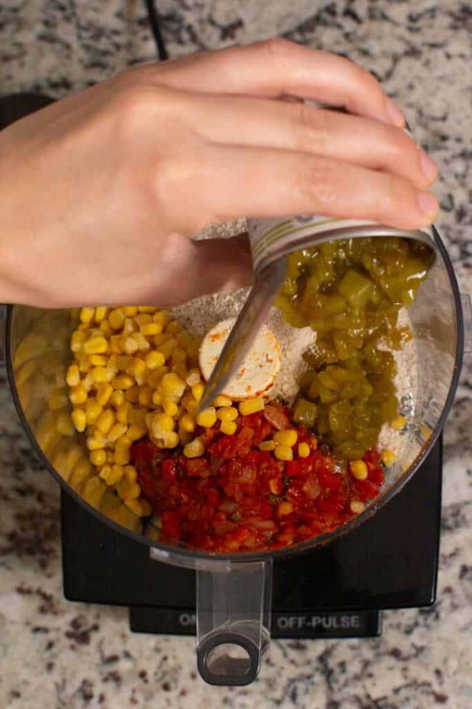 adding diced green chilis to food processor
