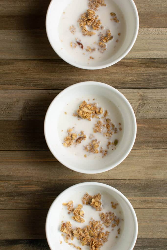 3 bowls of granola in milk to show the texture 