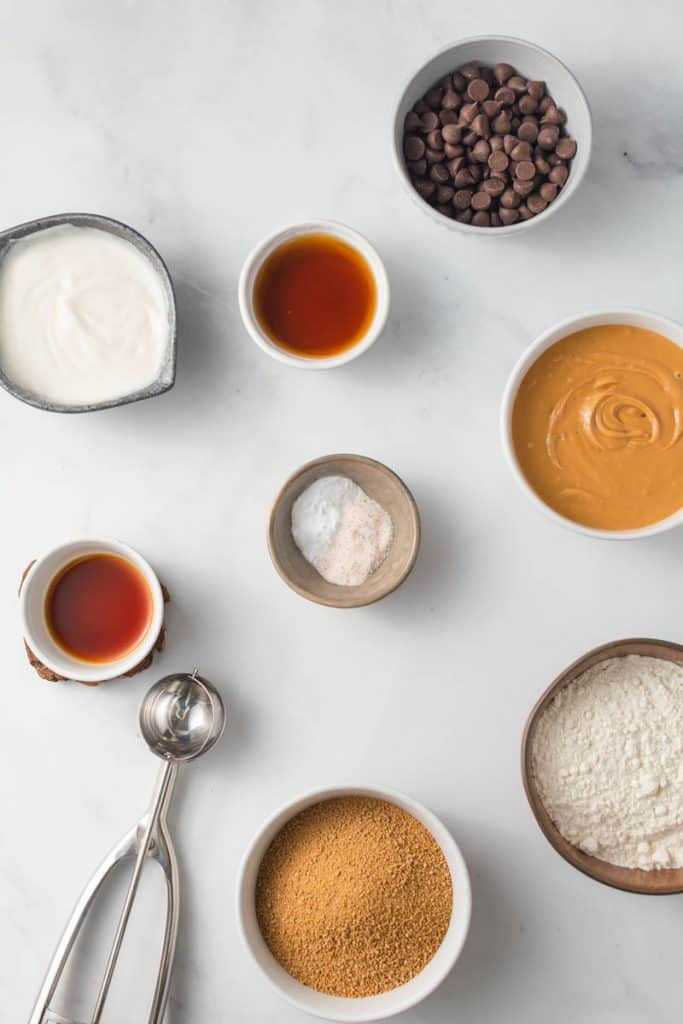 Overhead of ingredients needed to make peanut butter chocolate chip cookies.