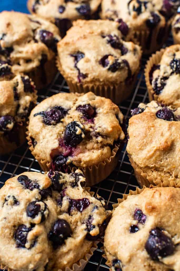 close up of blueberry muffins on cooling rack.