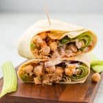 Side view of two halves of the chickpea wrap stacked on top of each other so you can see the filling.