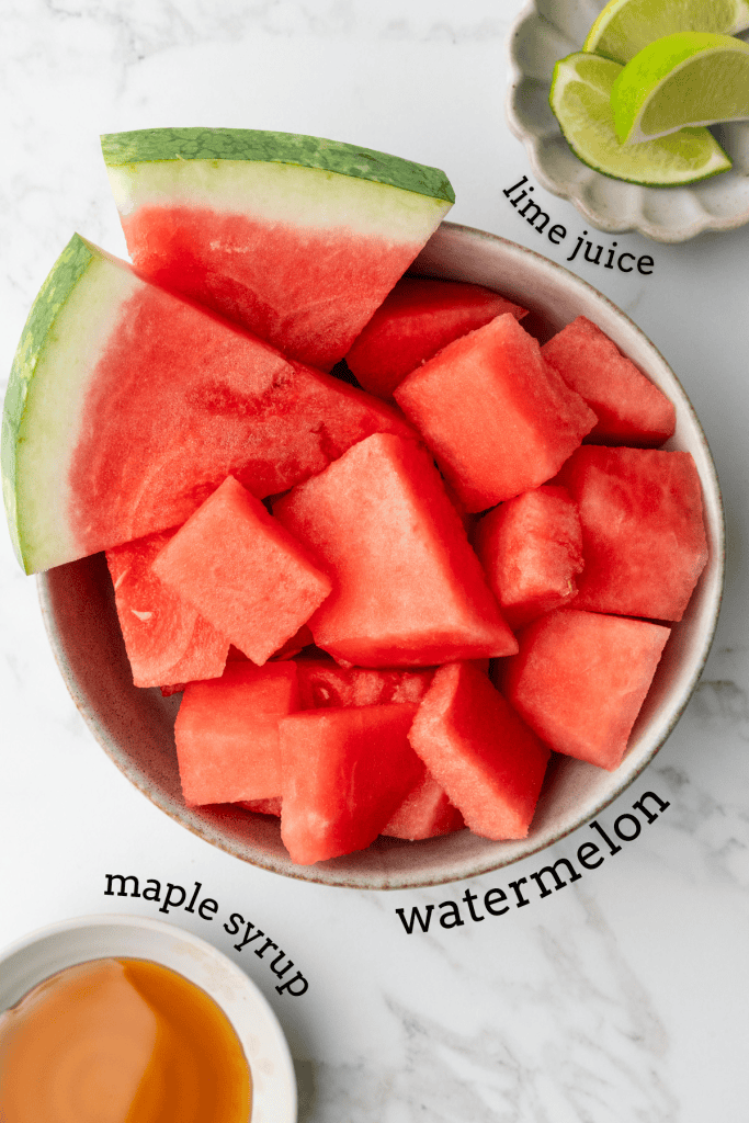 overhead shot of watermelon sorbet ingredients in individual labeled bowls.