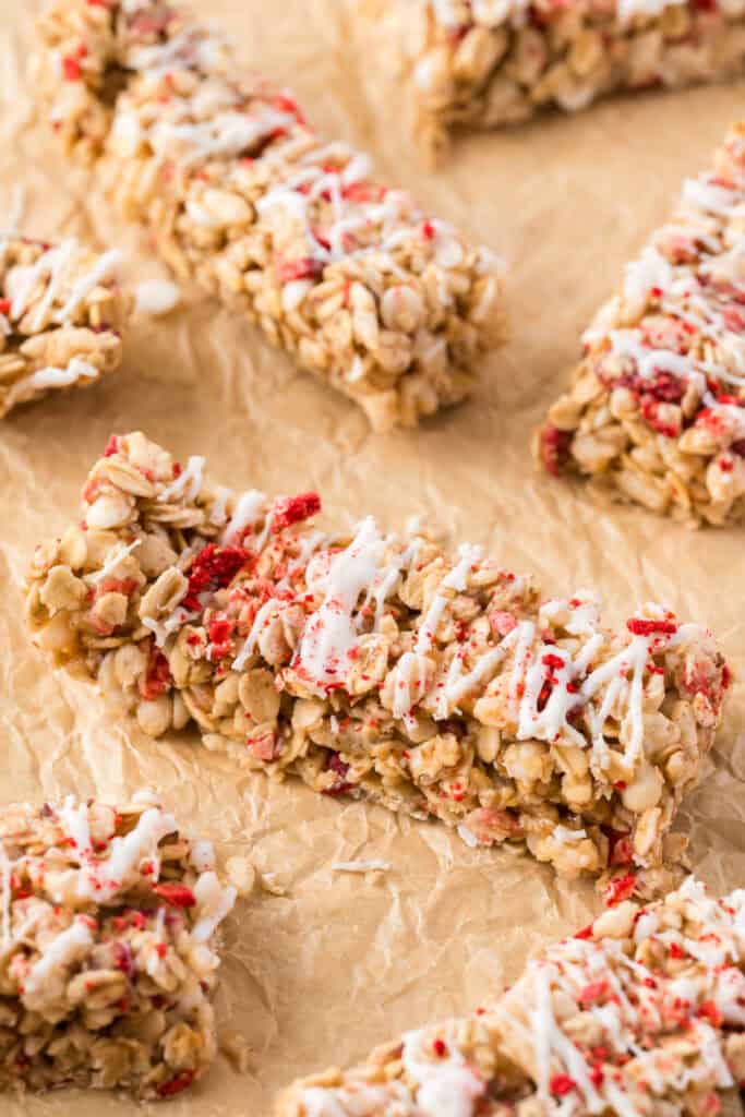 granola bars spread on brown parchment paper.